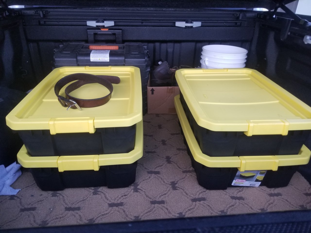 Rubbermaid type containers that fit in the Crewmax bed.