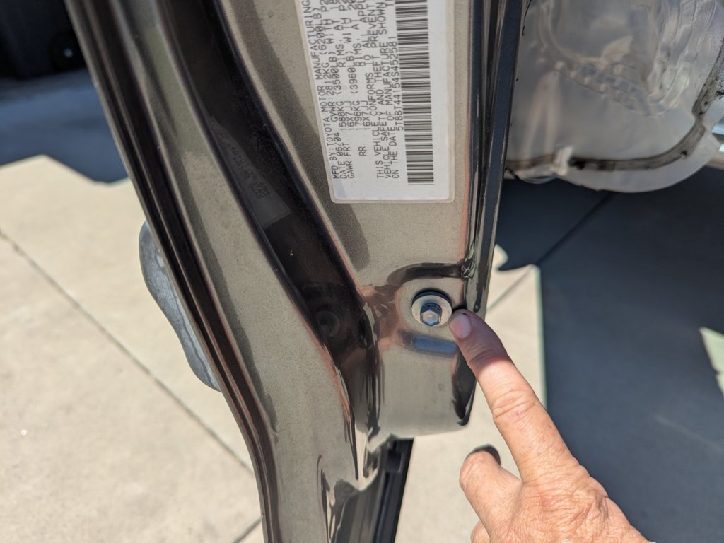 3.8 Remove bolt holding lower vertical window track .jpg