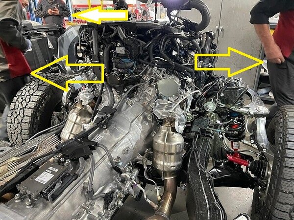 3 guys looking at repair taking pictures.jpg
