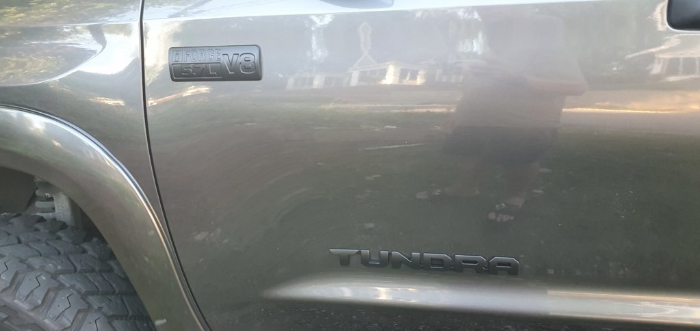 Black driver door emblem.jpg