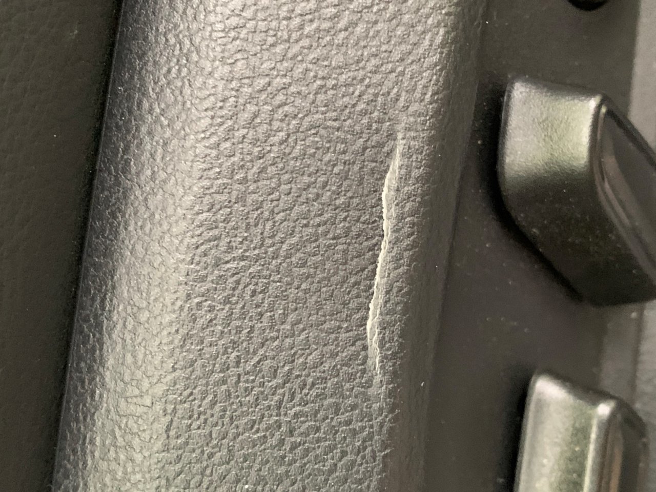 Cracked drivers side seat base.jpg