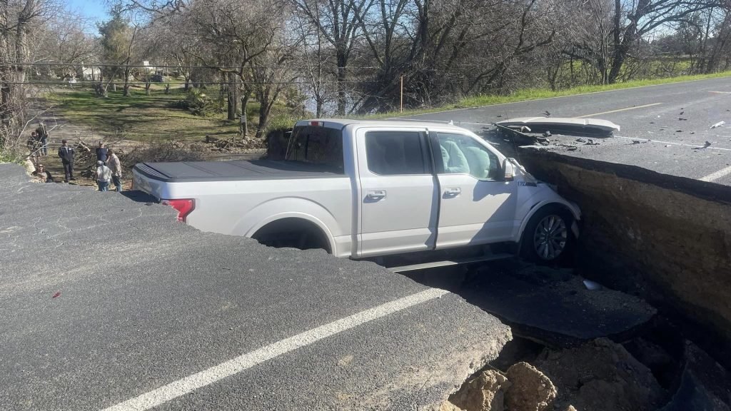 f150 in road sink hole.jpg