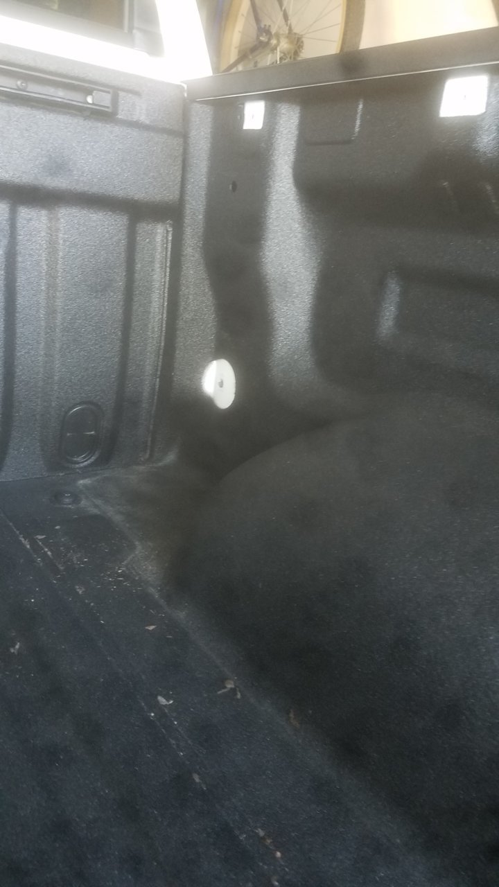 forward hole where storage bin anchored.jpg