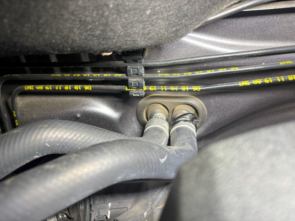 Heater pipes zip tied at firewall.jpg