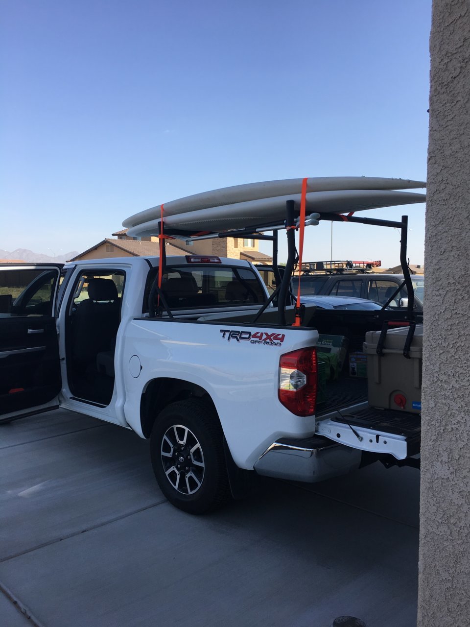 Kayak on top 2024 of tonneau cover