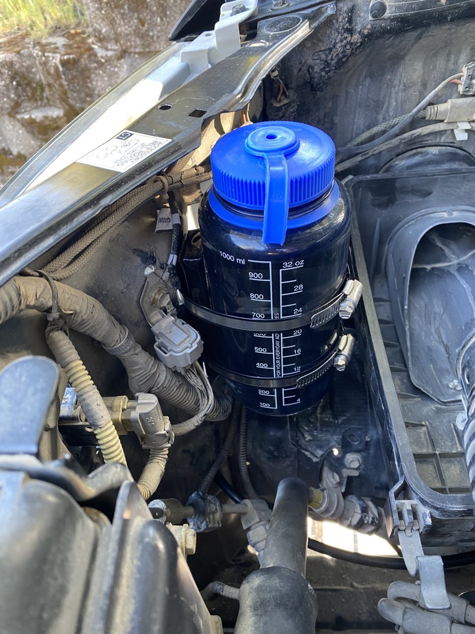Windshield fluid reservoir relocation using a Gatorade bottle lol :  r/Subaru_Outback