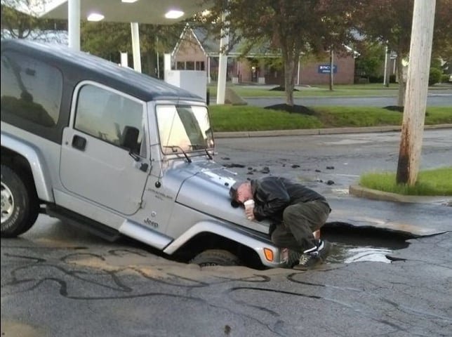 jeep in sink hole.jpg