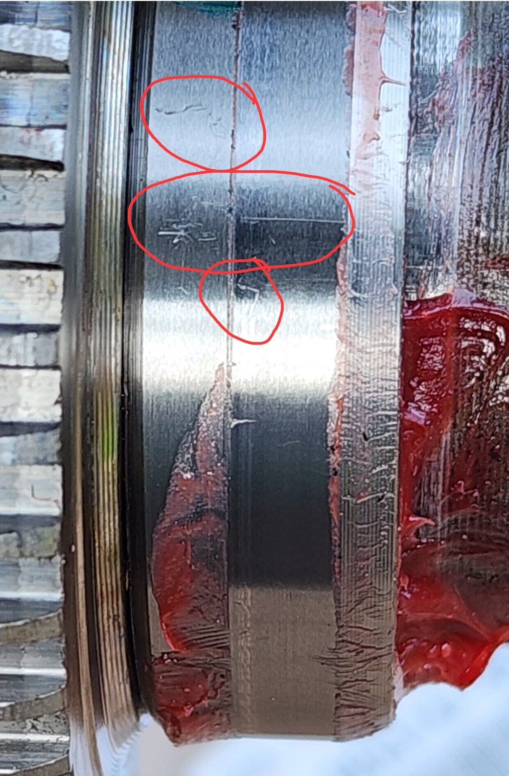 Retainer with grease line and scratches.jpg
