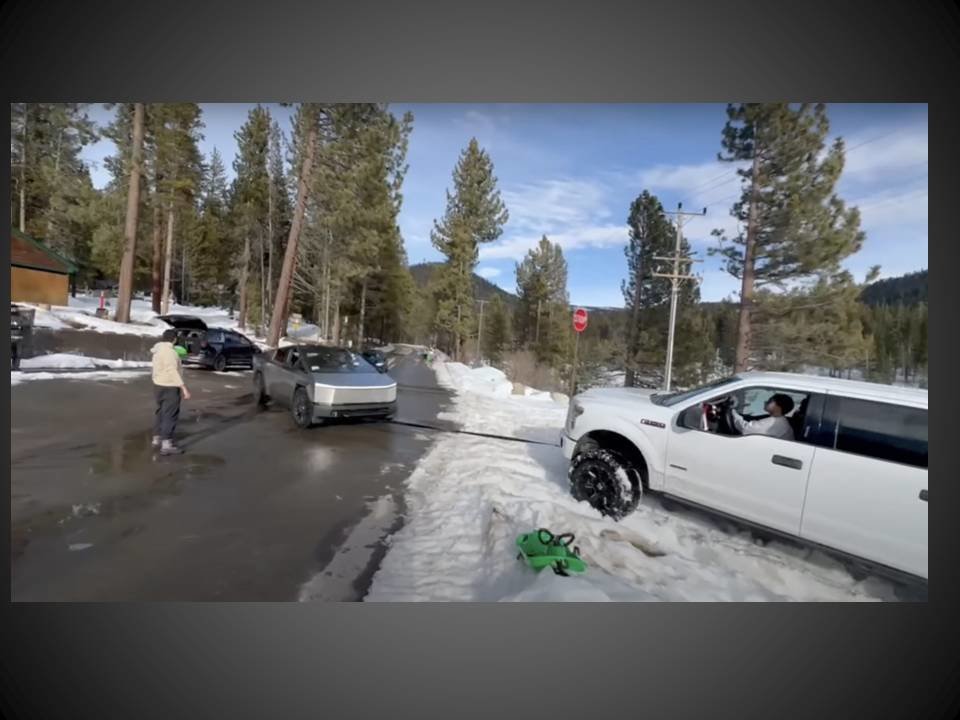 Tesla CT pulls F150 out of the snow.jpg