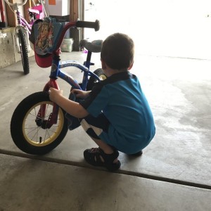 We washed the truck, and now he wants to clean his bike. Haha