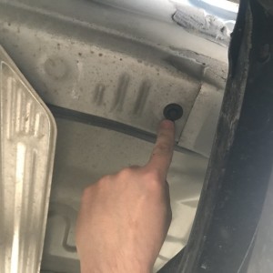 Gasket in frame underneath rear passenger side cab