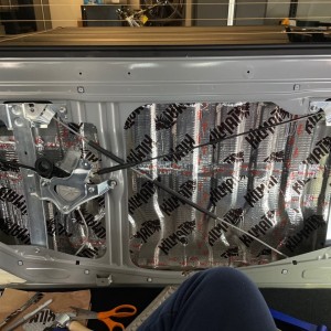 Rear panel sound deadening