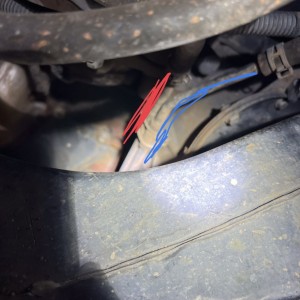 Transmission coolant lines by front crossmember